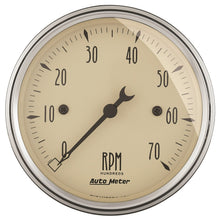Load image into Gallery viewer, AutoMeter 1898 Traditional incandescent lighting illuminates around the perimeter of the dial