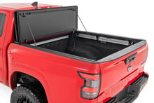Load image into Gallery viewer, Hard Tri-Fold Flip Up Bed Cover | 5' Bed | Nissan Frontier 2WD/4WD (22-26)